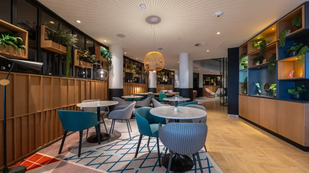 Lobby with seating areas and blue chairs