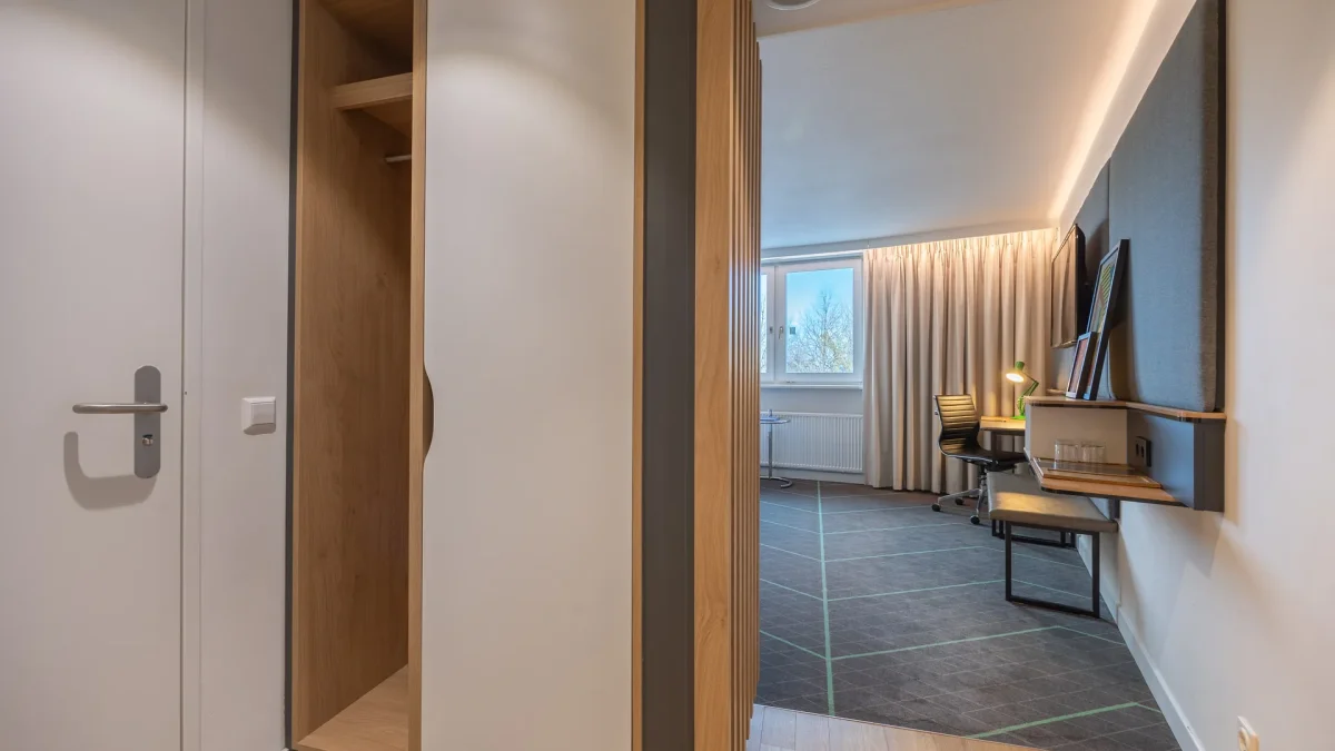 Entrance of a hotel room with a wardrobe